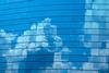 building_windows_cloud_reflections
