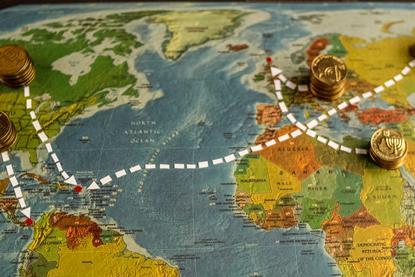 Coins with white lines leading to famous offshore zones on world map
